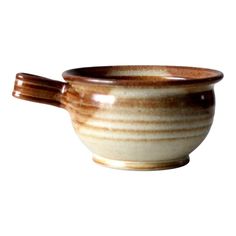 a brown and white bowl with handles on a white background, it looks like something from the movie star trek