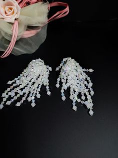 Elegant handmade earrings with Japanese crystals and glass beads. These earrings are special, the crystals cascade freely and are very bright. The earrings are white with crystal reflections. The earrings are clip-on, for those who do not have pierced ears and with a normal open hook, you can choose. They are very romantic and perfect for a beach bride. For those who love elegant and romantic style All jewels are delivered in a decorated box, ready to be given as a gift to your loved one. How to take care of your jewellery: put on your beauty products (cosmetics, perfumes, ...) before wearing your precious jewel. Clean your jewelry with a soft cloth after wearing. Don't use water. Make sure you store your jewelry separately to avoid scratching it. Store away from heat sources, in a dry pla Crystal Fringe, Bridal Clip, Beach Bride, Precious Jewels, Earrings Elegant, Earrings Crystal, Crystal Drop Earrings, Crystal Drop, Fringe Earrings