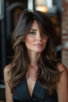 Layered long shag haircut with feathered, wispy ends