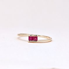 Natural Fine Ruby Ring. Baguette Stone Ring. Precious Gemstone Ring in 14k SOLID GOLD For Her from our Capsule Jewelry Collection. Ruby Baguette Gemstones are set in Chenal Setting in our Factory. Gold Ring AA+ Quality. Perfect Gift For Everyday or July Birthstone Gift for Your Loved Ones. ►  DIMENSIONS : ◆ Gemstone : Ruby 0.70 Cts (2 pcs)                       ◆ Stone size : 2.5*2.5 mm                                     ◆ Shank Width : 1 mm      ◆  Material :  14k Yellow Gold          Made to Order      EACH Ring is Stamped With 585 Marked As 14k GOLD International Standard. All my gemstones are hand-selected for best quality assurance, then precisely sawed, and shaped into the desired geometry. The precious stones are then delicately grinned, sanded, and hand-polished to make sure each Minimal Jewelry Design, Capsule Jewelry, Ruby Ring Designs, 14k Gold Ruby Ring, Gold Ruby Ring, July Birthstone Ring, Ring Jewellery Design, Ring Baguette, Ruby Ring Gold