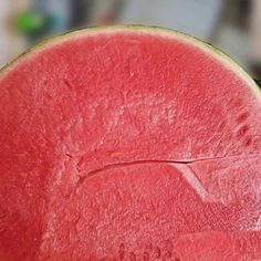 a slice of watermelon sitting on top of a table