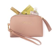 Blush pink vegan leather wristlet with tassel zipper pull. Gold embossed name match the gold accents on the zipper and the top of the tassel. Convenient size with enough space for all of your on-the-go necessities. Carry by itself or throw in your favorite bag for easy purse changes. Makes a beautiful gift for wedding parties, birthdays, Easter baskets, and more. 5.75" x 3.75" x 0.5" 6" Wristlet Strap PRE-PRINTED FROM THE MANUFACTURER. WE CAN NOT OFFER PERSONALIZATION IN HOUSE Batman Backpack, Hoops And Yoyo, Cat Coin Purse, Batman Kids, Gift Holders, Pink Wristlet, Gift For Wedding, Rainbow Brite, Girls Purse