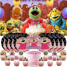 the sesame street birthday party with cupcakes, cake and muppet characters on it