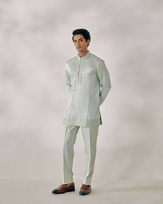 Featuring hand embroidered short jacket with applique, organza flower and french knots. Paired with matching color linen silk kurta set with pintuck details and tapered trousers. Traditional Spring Kurta With Set-in Sleeves, Festive Cotton Silk Kurta With Set-in Sleeves, Festive Kurta With Set-in Sleeves, Spring Festive Cotton Silk Sherwani, Spring Festive Silk Sherwani, Fitted Kurta With Set-in Sleeves For Festive Occasions, Elegant Linen Kurta With Resham Embroidery, Spring Designer Raw Silk Nehru Jacket, Spring Wedding Sherwani In Raw Silk