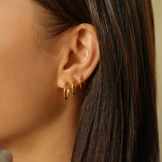 Classic Minimal Gold huggie hoop earrings that hug your ear perfectly. Fits all earlobe sizes and easy to put on/take off. Gold Vermeil Hypoallergenic, lead and nickel free Width 1.3mm Inside Diameter: 9mm, 11mm, 13mm Click close mechanism #E530, E032 3 Gold Hoop Earrings, Third Lobe Piercing Hoop, Curated Ears, White Gold Hoop Earrings, Contemporary Earrings, Stacked Earrings, Mini Hoop Earrings, Hoop Earring Sets, Huggie Hoop Earrings