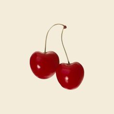 two cherries are shown on a white background