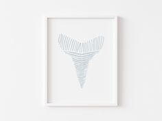 a white frame with a drawing of a tooth in the shape of an x - ray