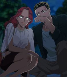 a man and woman sitting next to each other in front of a forest at night