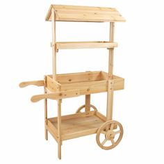 a wooden cart with wheels and shelves on it