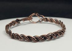 Braided Coiled and Bare Copper Bracelet. 7" long. This bracelet has been antiqued, polished and sealed. Sealed with Protectaclear. ProtectaClear is a clear, protective coating that is tough enough to protect jewelry and is safe for wear against skin. ProtectaClear is practically invisible once applied and will seal and protect jewelry from tarnish, oxidation, and corrosion. Sunstone Bracelet, Wire Wrap Jewelry Designs, Copper Cuff Bracelet, Labradorite Bracelet, Copper Cuff, Wrap Jewelry, Moonstone Bracelet, Argentium Silver, Copper Bracelet