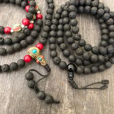 Everyday black lava stone mala necklace. You can choose between 2 styles. 1- A Mala necklace that is all black lava stones which is 43cm- 17 inch long (there is no clasp, you wear it over the head) 2-A Mala necklace which has black lava stones, red beads and unique Nepali beads. This Mala is 48cm- 19 inch long ( there is no clasp, you wear it over your head) This unique unisex mala necklaces can be a diffuser necklaces also, as you can choose which ever oil that you like to use with the lava roc Bohemian Black Lava Stone Jewelry, Black Lava Stone Jewelry With Round Beads, Black Lava Stone Bohemian Jewelry, Adjustable Black Beads Jewelry For Meditation, Black 8mm Beads Jewelry For Meditation, Black Beaded Lava Stone Jewelry, Black Beads Lava Stone Jewelry, Black Lava Stone Necklace For Gift, Black Necklace With 8mm Beads As Gift