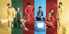 four people are sitting on different colored blocks with an old typewriter in front of them