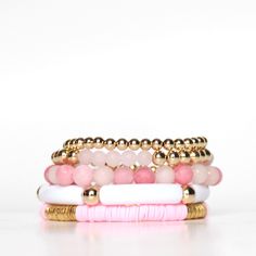 Pink and gold beaded stretch bracelet stack | ELLIOT LANE – Elliot Lane Trendy Stackable Heishi Bead Bracelets, Trendy Gold Beaded Bracelets With Heishi Beads, Trendy Stacked Pink Beaded Bracelets, Trendy Pink Stacked Beaded Bracelets, Trendy Stacked Pink Bracelets, Trendy Pink Stacked Bracelets, Pink Stacked Stretch Bracelet As Gift, Adjustable Stackable Pink Stretch Bracelet, Pink Stacked Beaded Bracelets Gift