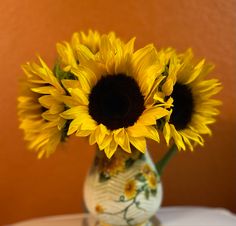 there is a vase with sunflowers in it