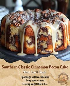 a cake with white icing and pecans on top