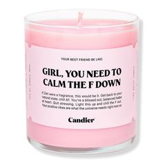 a pink candle with the words girl you need to calm the down written on it