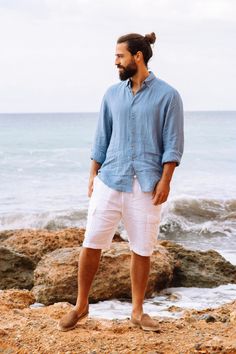 "A classic linen shirt for men features buttons in front and is made from lightweight linen to stay cool during summer. Wear sleeves down or roll them up for a more casual daytime look. Please note that due to the many variations in monitors and browsers, actual colors may vary. Matcha green / White - https://etsy.me/3tTAH85 Peach - https://etsy.me/3uLVOZj Pinstripe blue - https://etsy.me/3DthaOJ Sandy beige - https://etsy.me/3tSX65c - - - - - - - - - - - - - - - - - - - - - - - - - - - - - DETA Man Beach Photoshoot, Men’s Beach Outfits, Egypt Summer, Mens Beach Style, Mens Linen Shorts, Themed Photoshoot, Linen Clothing, Linen Shirt Men, Mens Linen