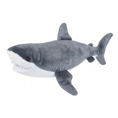 a stuffed shark is shown on a white background