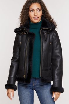 Jane Sheepskin B-3 Bomber Jacket with Detachable Hood | Overland Sheepskin Aviator Jacket With Faux Fur Lining, Winter Shearling Leather Jacket With Faux Fur Trim, Shearling Leather Jacket With Faux Fur Trim For Winter, Hooded Leather Jacket With Fleece Lining For Cold Weather, Aviator Shearling Fur Coat With Faux Fur Lining, Shearling Aviator Fur Coat With Faux Fur Lining, Shearling Aviator Fur Coat For Fall, Winter Aviator Outerwear With Faux Fur Trim, Winter Aviator Sheepskin Leather Jacket