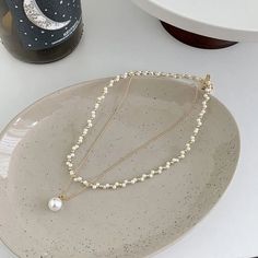 ✦ Make a statement with our Elegant Layered Pearl Necklace. This stunning necklace showcases multiple layers of luminous pearls, creating a chic and fashionable layered effect. The intricate design and the elegant pendant enhance the beauty of the pearls, adding a touch of glamour to your ensemble. Whether dressed up or down, this layered pearl necklace is a perfect accessory to elevate your style and capture attention wherever you go. ----------- DETAILS ------------ SKU: HN8552- Materials: All Elegant Multi-strand Necklace With Pearl Pendant, Pearl Pendant Necklace For Party, Elegant Multi-strand Pearl Chain Necklace, Multi-strand Pearl Necklace For Layering, White Pearl Layering Necklaces, Party Pearl Pendant Necklace, Pearl White Necklaces For Layering, Elegant Pearl Layered Necklace Gift, Elegant Pearl Layered Necklace As Gift