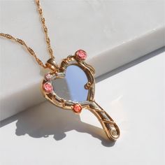 Description:Chic CZ Inlaid Barbie Magic Mirror Necklace Specifications:Material: cubic zirconia. copper. gold. silver. enamelColors: Gold/SilverSize: 40 cm + 5 cm extWeight: 4.8 g/pcs Features & Details:Material: This barbie magic mirror necklace is made of environmental friendly materials. which is solid. durable. lightweight and very comfortable and healthy for daily wear. Stylish design: The shiny. durable and comfortable mirror necklace shows the smooth surface of the jewelry that is laying Aesthetic Bracelets, Mirror Necklace, Barbie Aesthetic, Mirror Photo Frames, Magic Mirror, Wedding Party Jewelry, Environmental Friendly, Bracelets Jewelry, Elegant Necklaces