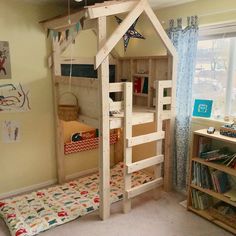 there is a bunk bed in the corner of this room with a ladder on it