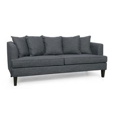 a gray couch sitting on top of a white floor