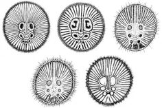 four different types of circular objects in black and white, each with an animal's face