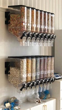 a wall mounted spice rack filled with lots of spices