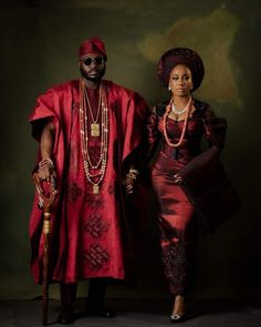 a man and woman dressed in traditional african clothing