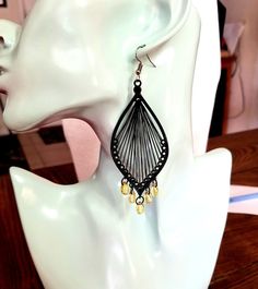 Pierced Teardrop Beaded Earrings, Pierced Teardrop Metal Beaded Earrings, Elegant Black Beaded Teardrop Earrings, Elegant Teardrop Black Bead Earrings, Black Beaded Teardrop Earrings, Black Teardrop Beaded Earrings, Elegant Black Chandelier Earrings With Dangling Beads, Metal Teardrop Danglers, Black Long Drop Earrings With Dangling Beads