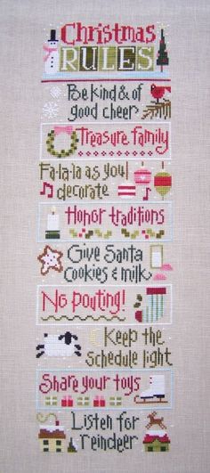 a cross stitch sample with the words christmas rules and other things on it's side