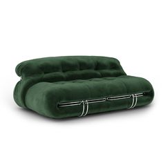 a green couch sitting on top of a white floor