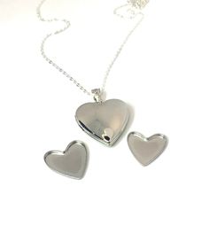 Made from SOLID Sterling Silver, this heart locket pendant opens like a normal locket. You can insert a photo on one side and the other side contains a heart compartment that clicks together which you can store your loved ones ashes or your pets, keeping them close to your heart always. You could also store sand from a beach or anything sentimental from a special place or a special someone.   ♥︎ Brand new and never been worn. Multiple available. ♥︎ Please feel free to message me with any questio Heart-shaped Nickel-free Locket Necklace For Valentine's Day, Nickel-free Heart Locket Necklace For Memorial, Heart-shaped Nickel-free Locket Necklace For Memorial, Memorial Heart-shaped Nickel-free Locket Necklace, Valentine's Day Locket Necklace, Nickel-free Heart Locket Necklace For Anniversary, Heart Shaped Locket Necklace For Memorial, Heart Charm Memorial Locket Necklace, Heart-shaped Locket Necklace With Heart Charm For Memorials