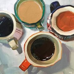 three cups of coffee sitting on top of a white tablecloth next to each other