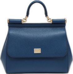 Large royal blue grained leather handbag from Dolce & Gabbana featuring a front flap, a concealed snap closure, a top handle, an adjustable and removable shoulder strap, a logo plaque, an internal zip pocket with logo, a mobile phone pocket and metal feet. Luxury Blue Briefcase For Office, Blue Business Briefcase With Top Carry Handle, Blue Business Satchel With Top Carry Handle, Business Blue Satchel With Removable Pouch, Blue Top Handle Satchel For Business, Blue Satchel With Removable Pouch For Business, Business Blue Shoulder Bag With Gold-tone Hardware, Classic Blue Bags With Top Carry Handle, Classic Blue Bag With Top Carry Handle