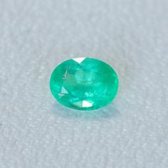 This loose stone is available for a custom ring by Anueva Jewelry. Select your stone first and then select a setting. Add both to your cart and we'll create your ring! 1.29CT OVAL BRILLIANT ZAMBIAN EMERALD, NEON GREEN, 8X6MM. We selected these emeralds for their vibrant, almost neon colors! Natural internal silk, common for emeralds. But still has great flash of sparkle! About Heat Treatments: Some colored gemstones are routinely heated for color and clarity improvement. This is a permanent trea Oval Emerald Gemstones For Wedding, Oval Emerald Wedding Gemstones, Gia Certified Oval Emerald Gemstone, Gia Certified Oval Emerald, Oval Untreated Green Emerald Ring, Untreated Oval Green Emerald Ring, Oval Emerald Gemstone For May Birthstone, Green Round Cut Emerald Gemstones, Classic Emerald Cut Birthstone Gemstones