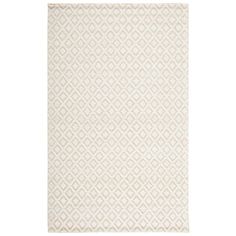 a white rug with diamond shapes on it