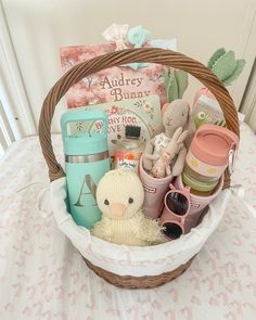 a basket filled with baby items sitting on top of a table