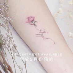 a woman's arm with a pink flower on it and the words appointment available in chinese