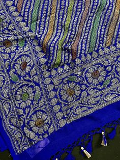 SILK MARK CERTIFIED !!! Stunning Royal Blue Color Pure Khaddi Georgette Silk Saree with Antique Copper and Platinum Zari Weaving Floral Jaal with Brush Paint. Item : Saree Base Fabric : Pure Khaddi Georgette Silk Color : Royal Blue Color Blouse piece : Comes with un-stitched Blouse piece. Blouse material : Pure Khaddi Georgette Silk Work : Handloom Fall & Edging(Yes/No) : Yes Silk Mark Certificate given with the Saree(Yes/No) : Yes Disclaimer -: - Color variation is possible due to various reasons like phone or desktop setting, resolution etc. Please don't hold us responsible. Our aim is to put the exact color of the Saree. - If the Saree is Pure Silk, we will put it very clearly in our listing that it is Pure Silk. If we do not mention its Pure Silk please do not assume it is Pure Silk. W Blue Traditional Wear For Celebration, Blue Bohemian Traditional Wear For Wedding, Bohemian Blue Traditional Wear For Wedding, Blue Transitional Traditional Wear For Celebrations, Blue Traditional Wear With Zari Weaving For Celebration, Blue Traditional Wear With Traditional Patterns For Transitional Season, Bohemian Blue Dupatta For Wedding, Festive Blue Dupatta With Traditional Patterns, Blue Dupatta With Traditional Patterns For Festive Occasions