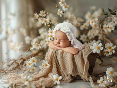 a baby is sleeping in a basket with white flowers