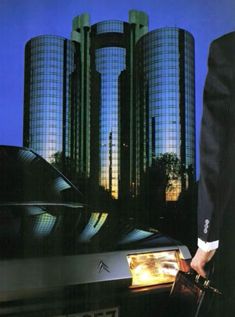 an advertisement for citroen'n bx featuring a man in a suit holding a briefcase