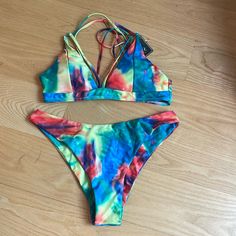 This Listing Is For A Brand New With Tags Zaful Brand, Rainbow Tie-Dye Bikini In A Women’s Size 8. If You Have No Experience With This Brand, Just Know The Bottoms Are Always Always So Nicely Made. They Are Always Fully Lined With The Same Fabric That Is On The Outside. So You Never Get That Little White Lining Flipping Over Or Anything. They Are Finished Very Nicely. Please Let Me Know If You Have Any Questions. Thank You So Much For Shopping My Closet Feel Free To Bundle And Save Offers Are Always Welcome. Please Note The Top Has Nice Detailing In The Front And The Back The Leasing In The Back Is Really Pretty. Tie Dye Triangle Top Swimwear For Summer, Tie Dye Swimwear For Summer Pool Days, Summer Tie Dye Triangle Top Swimwear, Tie Dye Triangle Top Swimwear, Tie Dye Swimwear For Pool In Summer, Summer Tie Dye Swimwear For Pool, Summer Tie-dye Swimwear For Pool, Tie-dye Swimwear For Summer Pool, Tie Dye Triangle Top Swimwear For Swimming