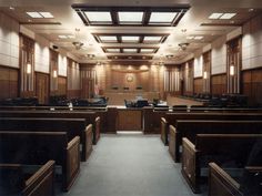 an empty courtroom is shown with no people in the room or on the desks