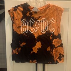 Never Worn With Tags Attached. Black And Orange Muscle Cropped Tee. Ac/Dc Forever 21.Size Small/Medium. Black And Orange Tie Dyed Rebellious Cotton T-shirt With Graphic Print, Casual Cotton Muscle Tee For Fall, Rebellious Cotton Top With Graphic Print, Rebellious Cotton Graphic Print Tops, Rebellious Cotton Tops With Graphic Print, Rebellious Summer Crew Neck T-shirt, Casual Graphic Print Tank Top For Concert, Rebellious Crew Neck T-shirt For Summer, Trendy Crew Neck Tank Top For Concerts