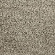 a close up view of a beige carpet textured with coarsed lines and dots