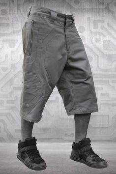 Grey men's short pants, Futuristic fashion, Alternative festival clothing, Three quarter pants with pockets, Street wear, Kamikaze, TUNKSA * 3/4 pants DUSTER robust and stylized *  * Elaborated design * 3D yoke * Inlaid fabric *  Perfect baggy cut * Nice finish *  * 2 big side zipped pockets * Open front to back * * 2 side zipped pockets * * 1 secret pocket * * Reinforced by rivets * * High quality YKK® zippers * * Made from 100% strong cotton twill * * These shorts are perfect for festivals, ou Three Quarter Pants, Fashion Alternative, Post Apocalyptic Fashion, Apocalyptic Fashion, Baggy Shorts, Kamikaze, Festival Clothing, Futuristic Fashion, Pants With Pockets