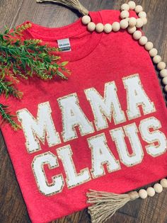 Women's MaMa Claus embroidered varsity letter shirt. GILDAN Heavy Cotton SHORT SLEEVE shirt is used to complete this design.  Care: Wash Cold, inside out. Lay flat to dry. Steam to remove wrinkles. Processing time is 7-14 days, not including weekends!! Mom Christmas Shirt, Varsity Letters, Letter Shirt, Womens Christmas Shirts, Varsity Letter, Womens Christmas, Mrs Claus, Shirt Embroidery, Christmas Mom