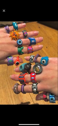 several different types of rings on someone's hand